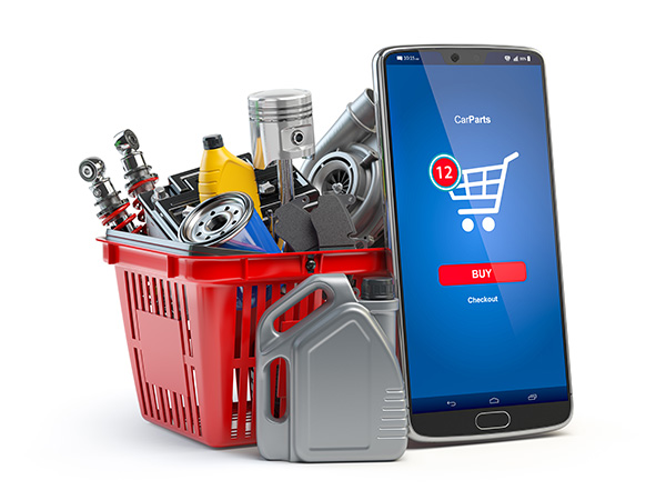 Car parts in basket next to phone